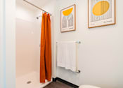 Thumbnail 10 of 54 - A bathroom with a white towel hanging on the wall.