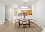 Thumbnail 6 of 15 - Kissimmee, FL Townhomes for Rent - Estates at Lake Cecile – A dining room with hard wood flooring
