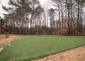 Thumbnail 17 of 24 - Flats at Riverview apartments in Duluth, GA 30096 photo of green field