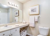 Thumbnail 6 of 23 - Ashford at Spring Lake apartments in Atlanta Georgia photo of bathroom with long vanity