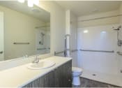 Thumbnail 11 of 18 - a bathroom with a sink toilet and shower