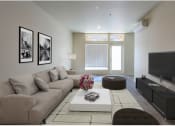 Thumbnail 3 of 18 - a living room filled with furniture and a flat screen tv