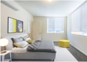 Thumbnail 5 of 18 - a bedroom with a bed and two windows