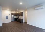 Thumbnail 6 of 18 - a kitchen with a refrigerator freezer and a stove top oven