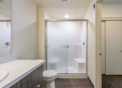 Thumbnail 12 of 18 - a bathroom with a toilet sink and shower