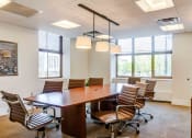 Thumbnail 27 of 38 - Conference room with table and chairs in light-filled space