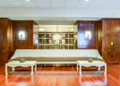 Thumbnail 29 of 38 - Long white leather sofa against wall in main entry lobby