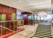 Thumbnail 30 of 38 - Main entrance doors and stairs with crystal chandelier