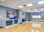 Thumbnail 20 of 38 - Yoga studio with polished birch flooring and loaner mats
