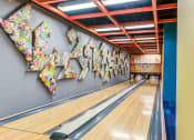 Thumbnail 12 of 38 - Bowling alley with art installation on wall