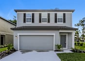 Thumbnail 1 of 38 - A modern house with a grey garage door.