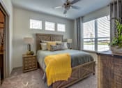 Thumbnail 8 of 25 - Bedroom with natural light in pet-friendly apartments in North Georgetown TX