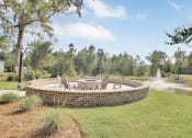 Thumbnail 17 of 28 - Omnia at Richmond Hill Townhomes in Georgia photo of fire pit and seating area