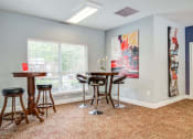 Thumbnail 15 of 24 - Flats at Riverview apartments in Duluth Georgia photo of clubhouse seating