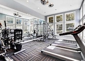 Thumbnail 3 of 12 - One K apartments in Atlanta Georgia- A well-equipped gym with treadmills, weights, and exercise machines.
