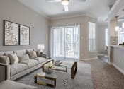 Thumbnail 6 of 20 - Apartments near Alief Texas for Rent – Gramercy Park – a living room with a couch and a coffee table