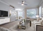 Thumbnail 10 of 20 - Houston Apartments – Gramercy Park – living room with large windows, ceiling fan, and a view of the dining room