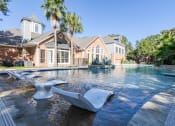 Thumbnail 2 of 20 - Apartments in Houston, TX for Rent – Gramercy Park - Resort Style pool with in the water lounge chairs