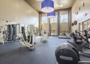 Thumbnail 17 of 20 - Apartments near Alief Texas for Rent – Gramercy Park – a gym with cardio equipment and weights