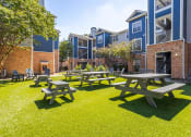 Thumbnail 4 of 20 - Apartments in Houston, TX for Rent – Gramercy Park -  our picnic tables are in the courtyard of our apartments