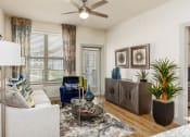 Thumbnail 2 of 43 - a living room with a ceiling fan and a large window