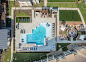 Thumbnail 1 of 35 - An aerial view of a pool and a building.