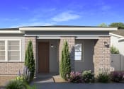 Thumbnail 3 of 16 - a small brick house with a front door