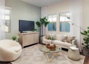 Thumbnail 9 of 16 - a living room with a couch and a tv