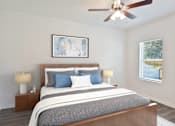 Thumbnail 53 of 63 - A bedroom with a large bed and a ceiling fan.