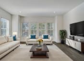 Thumbnail 3 of 14 - Pet-Friendly Townhomes in Avondale Estates, GA – Henley Avondale – living room with white couches and a coffee table, hardwood floors and large windows