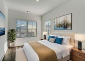 Thumbnail 6 of 14 - Henley Avondale Townhomes near Scottdale, GA photo of a bedroom with a bed and two windows