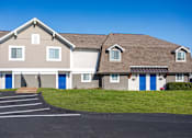 Thumbnail 16 of 17 - Apartments in Antioch, TN 37013 for Rent – Hickory Lake - A building with a grey roof and blue doors.