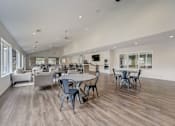 Thumbnail 15 of 19 - Spacious clubhouse with modern seating at Hinton Heights Apartments in Cottage Grove, MN, offering inviting shared spaces for residents of 1, 2, and 3 bedroom apartments for rent.