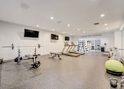 Thumbnail 3 of 19 - Modern fitness center with cardio and strength equipment at Hinton Heights Apartments in Cottage Grove, MN, serving residents of 1, 2, and 3 bedroom apartments for rent.