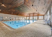 Thumbnail 9 of 19 - Indoor swimming pool at Hinton Heights Apartments in Cottage Grove, MN, providing year-round recreation for residents of 1, 2, and 3 bedroom apartments.