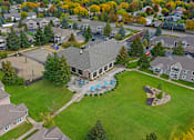 Thumbnail 17 of 19 - Hinton Height_Cottage Grove_MN_an aerial view of a neighborhood with houses and a swimming pool