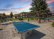 Thumbnail 12 of 19 - Hinton Height_Cottage Grove_MN_enjoy a game of ping pong at our community courts with picnic tables and chairs