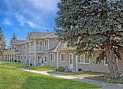 Thumbnail 18 of 19 - Hinton Height_Cottage Grove_MN_a row of houses with trees in front of them