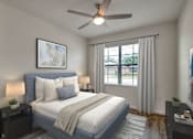 Thumbnail 27 of 35 - A bedroom with a bed, nightstands, and a ceiling fan.