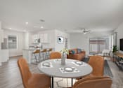 Thumbnail 13 of 35 - A modern dining room with a round table and chairs.