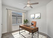 Thumbnail 33 of 35 - A room with a brown desk and a ceiling fan.