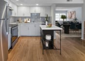Thumbnail 2 of 23 - Horizons North Apartments near North Miami Beach Florida Photo Of a kitchen with white cabinets and stainless steel appliances