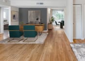 Thumbnail 4 of 23 - Horizons North Apartments near Carver Ranches, West Park, Florida photo of a living room with hardwood floors and white walls