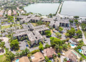 Thumbnail 22 of 23 - Horizons North Apartments in Miami Florida photo of an aerial view of a large building with a lake in the background