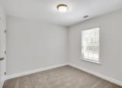 Thumbnail 17 of 26 - Harris Trail Luxury Townhomes for rent Richmond Hill, GA photo of bedroom with plush carpeting