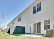 Thumbnail 3 of 26 - Harris Trail Luxury Townhomes for rent Richmond Hill, GA photo of back yard area of townhome