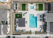 Thumbnail 26 of 47 - A bird's eye view of a house with a swimming pool.