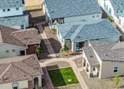 Thumbnail 35 of 47 - A bird's eye view of a neighborhood with houses and a green lawn.