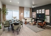 Thumbnail 5 of 47 - A modern living room with a dining table set for six.