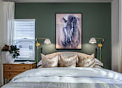 Thumbnail 15 of 47 - A bedroom with a large painting of a horse on the wall.